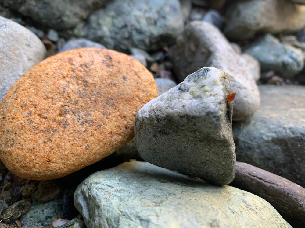 a rock sitting on top of a pile of rocks