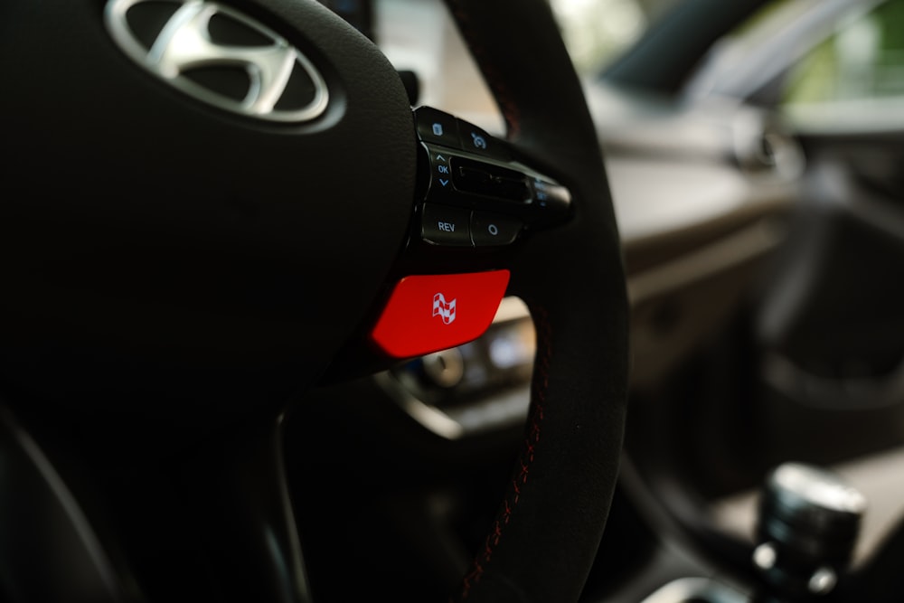 a close up of a steering wheel of a car