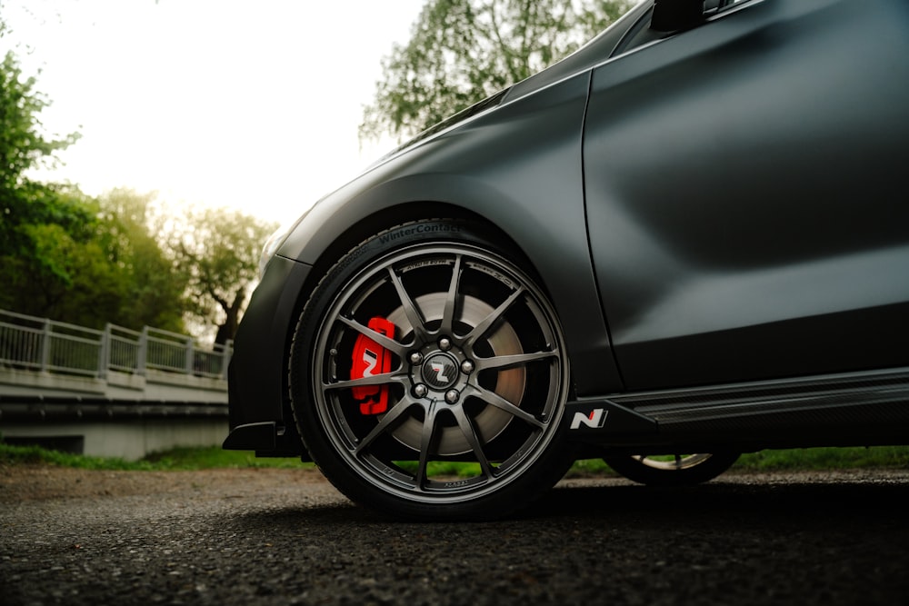 a close up of a car tire on a road