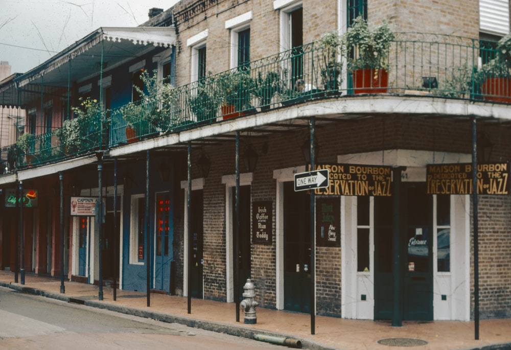 a street corner with a building and a fire hydrant