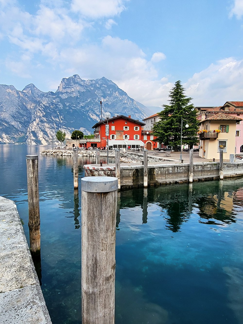 a body of water next to a wooden dock