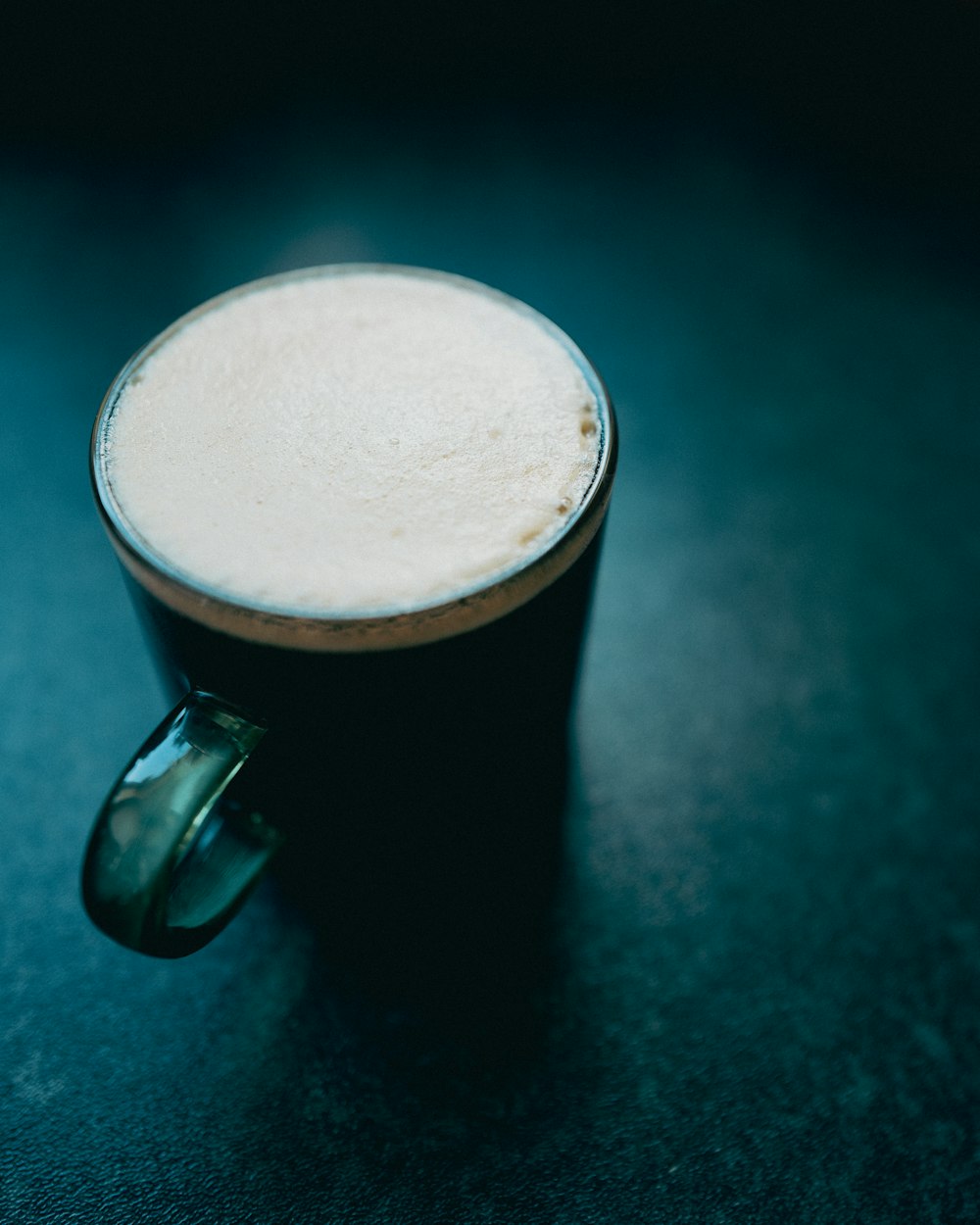 a close up of a cup of coffee on a table