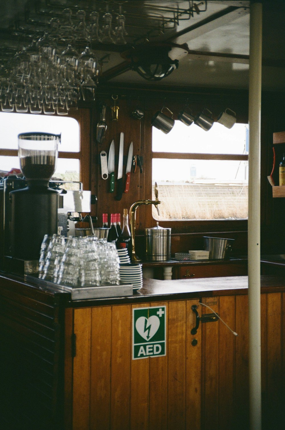 a kitchen with a lot of bottles on the counter