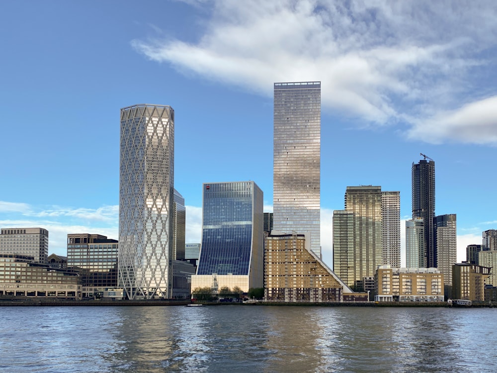 a large body of water with a city in the background