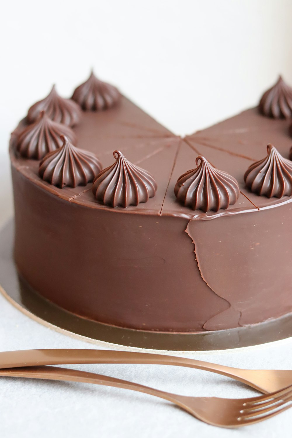 a chocolate cake sitting on top of a white table