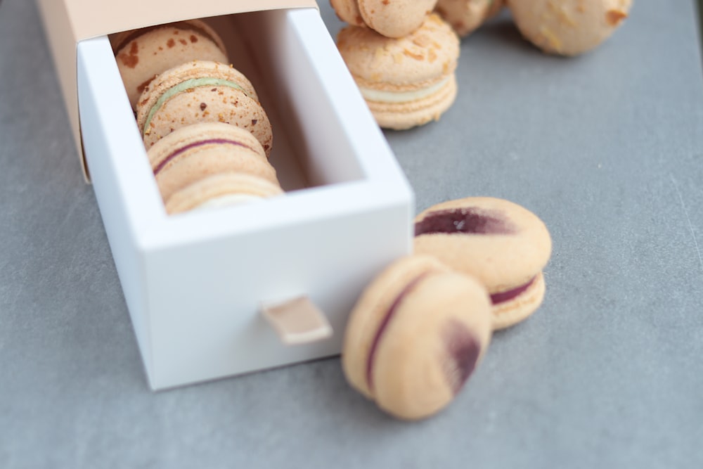 a box of macaroons sitting on a table