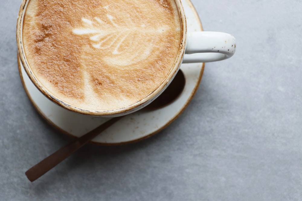 a cup of coffee with a spoon in it