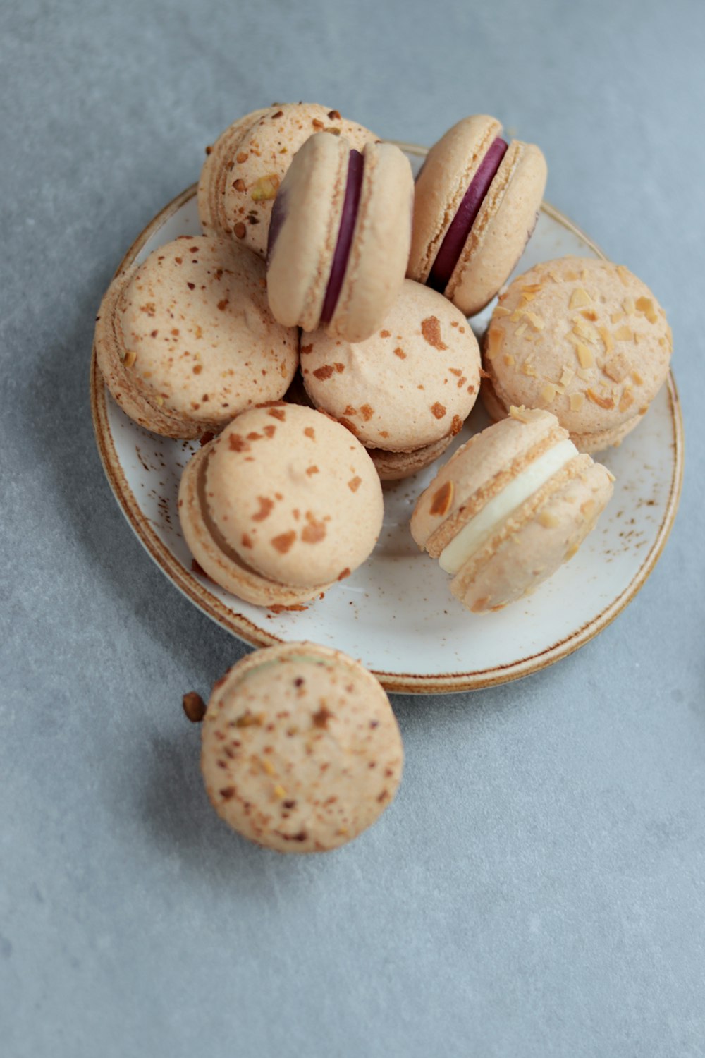 a plate of macaroons on a table