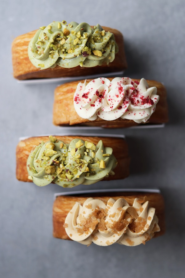 Four pieces of bread with different toppings on them