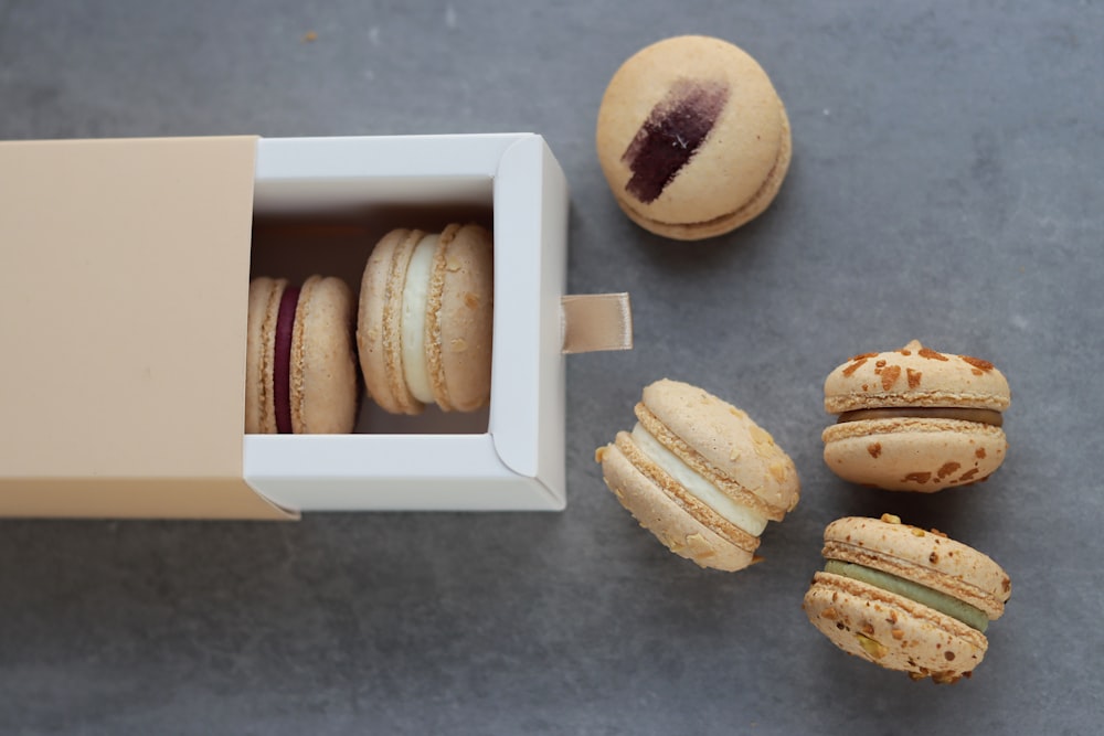 a box of macaroons sitting next to a box of macaroons
