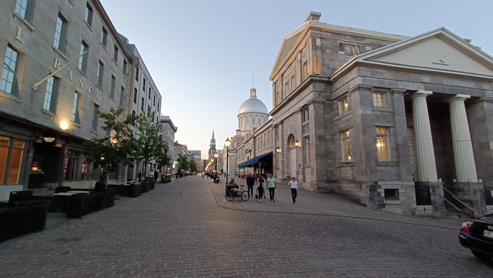 a cobblestone street lined with tall buildings