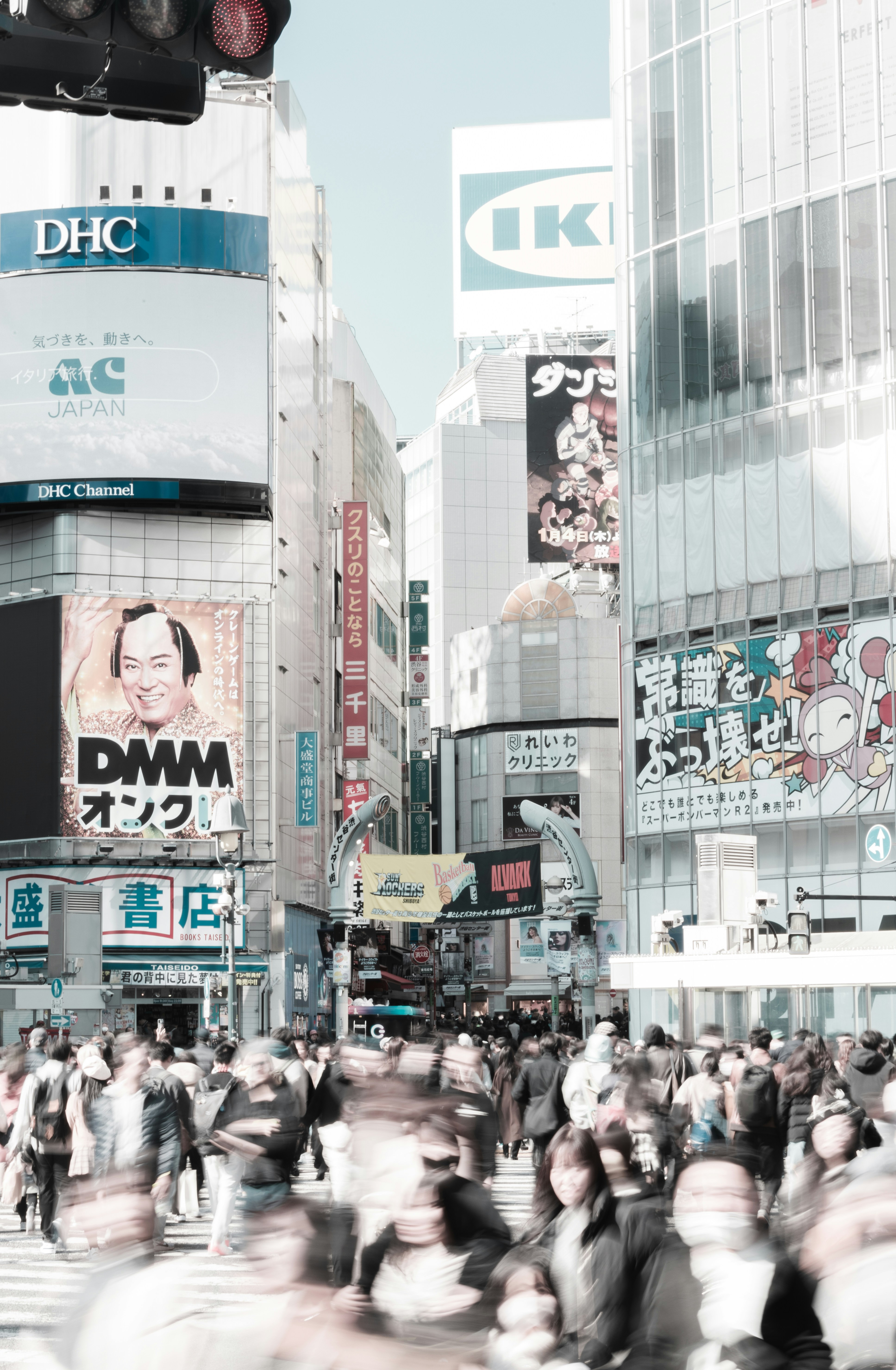 a large group of people walking across a street
