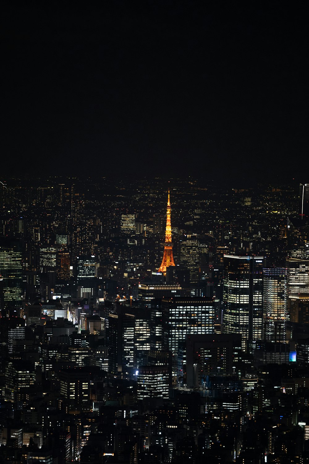 the eiffel tower is lit up at night