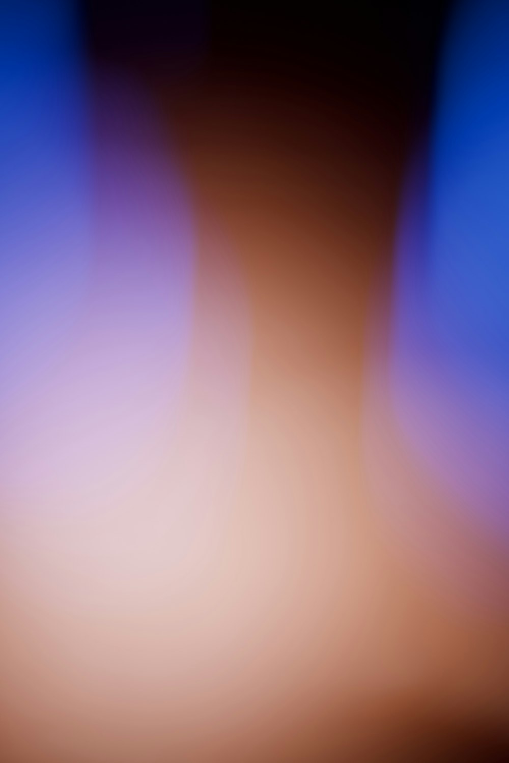 a blurry image of a blue and brown background