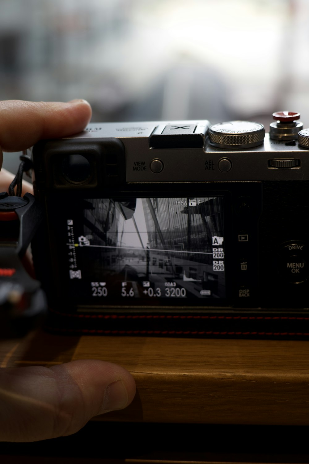 a person taking a picture of a boat with a camera