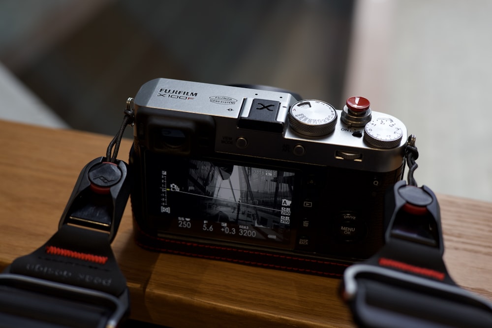 a camera sitting on top of a wooden table