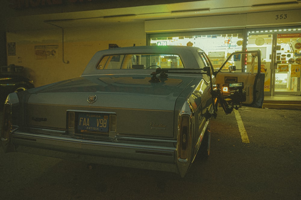 a car is parked in front of a store