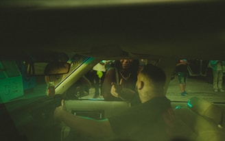 a group of people sitting in the back of a car