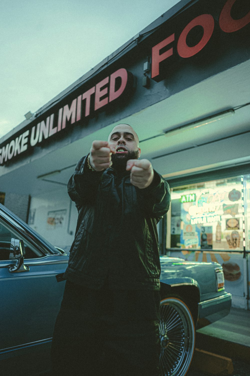 a man pointing a gun at the camera