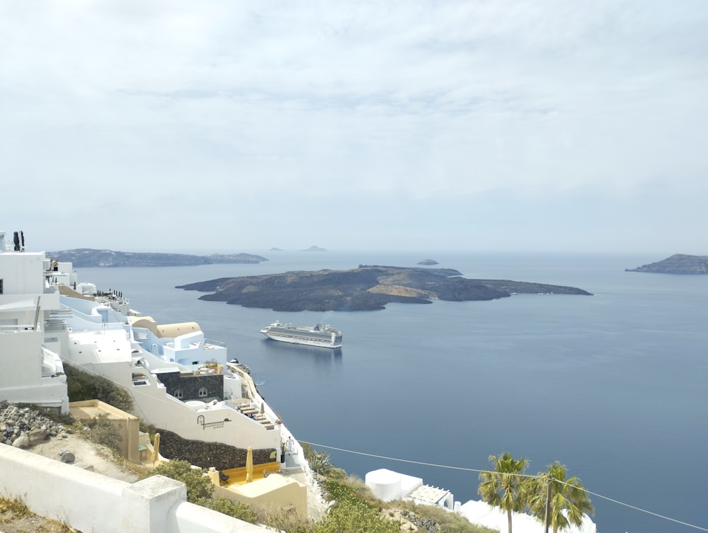 a view of the ocean and a cruise ship in the distance