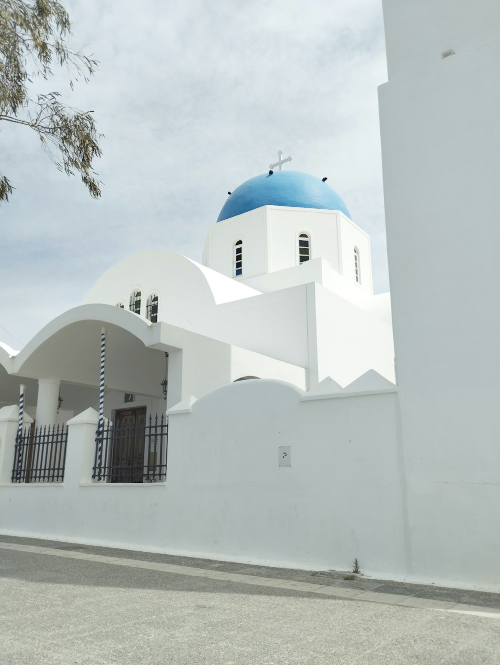 a large white building with a blue dome