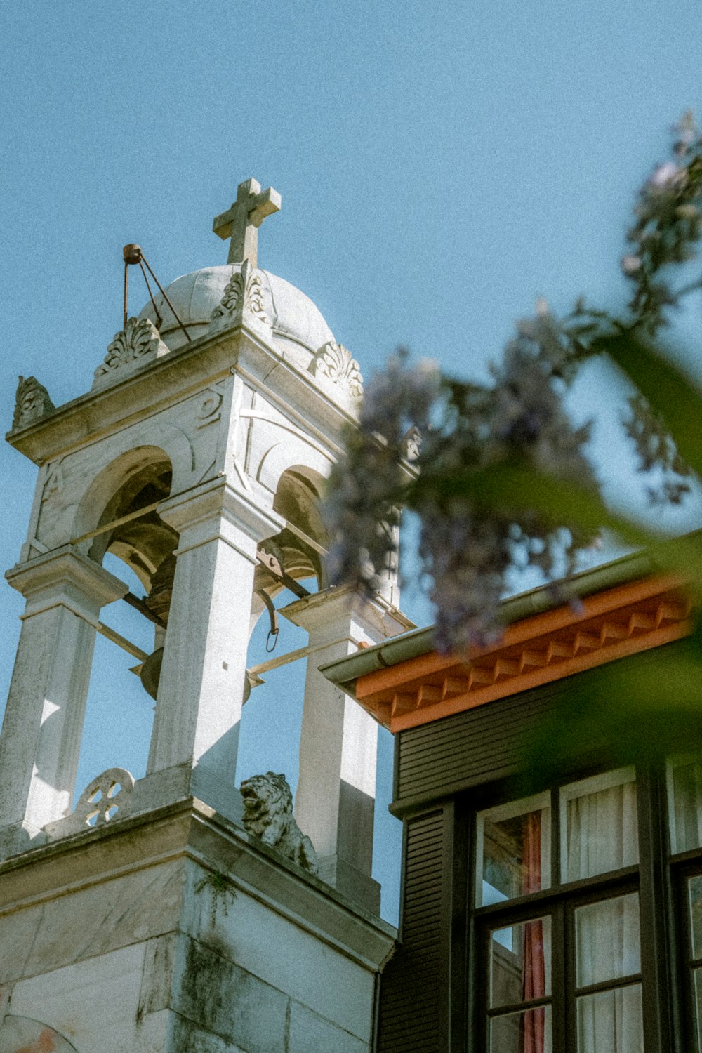 a bell tower with a cross on top of it