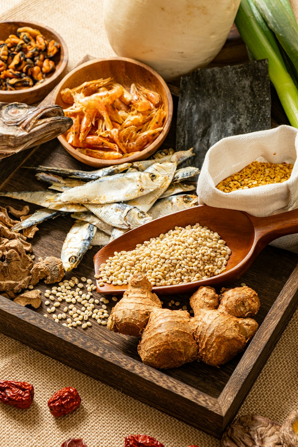 a wooden tray topped with different types of food