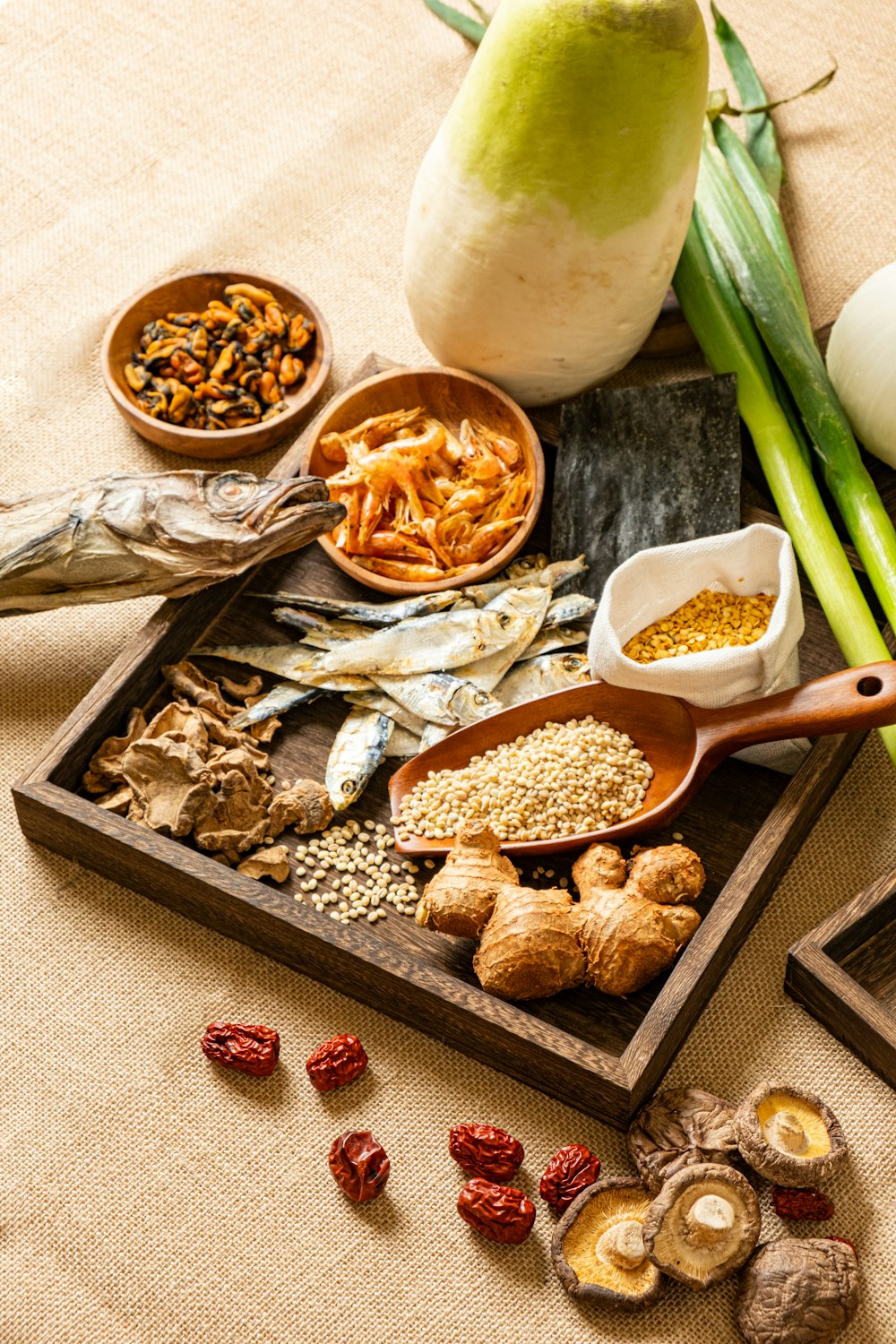 a table topped with bowls of food and vegetables