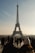 a group of people standing in front of the eiffel tower