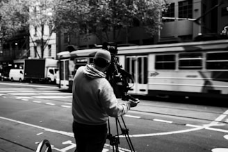 a man with a camera on a city street