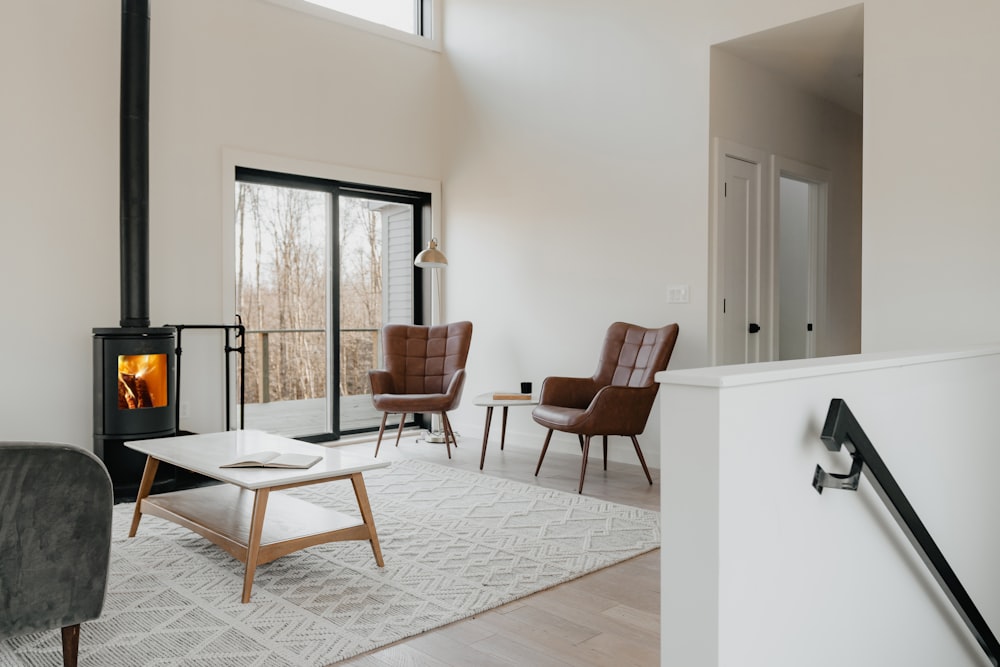 a living room filled with furniture and a fire place