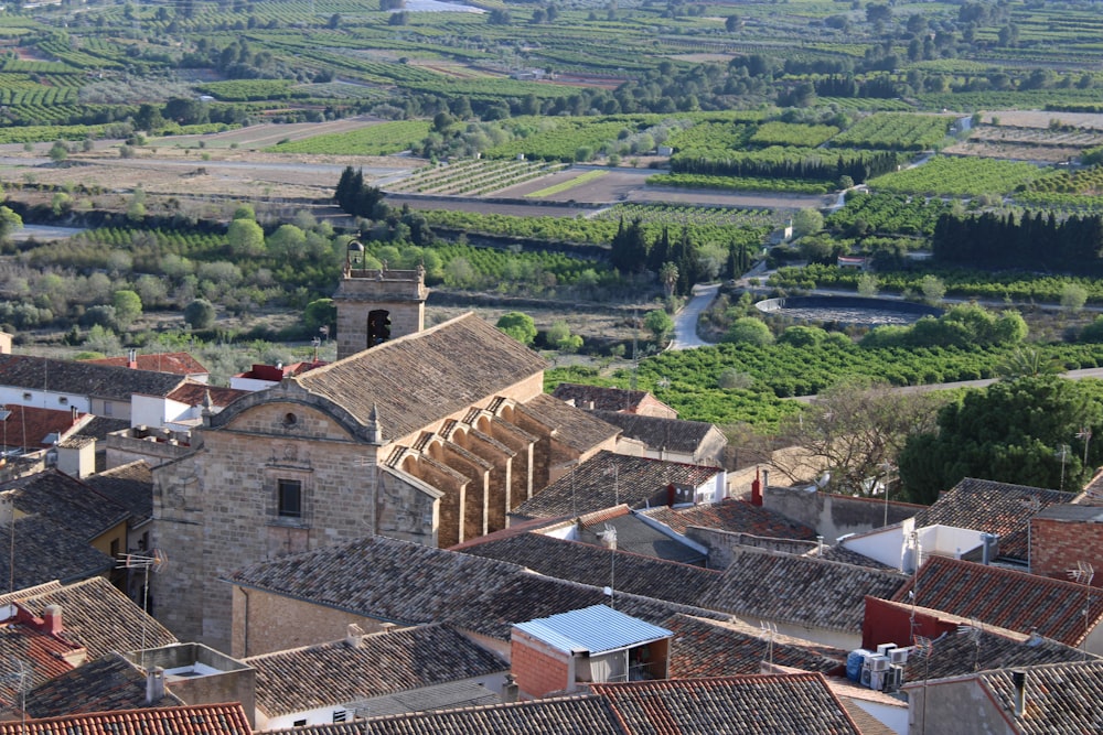 an aerial view of a village with a river running through it