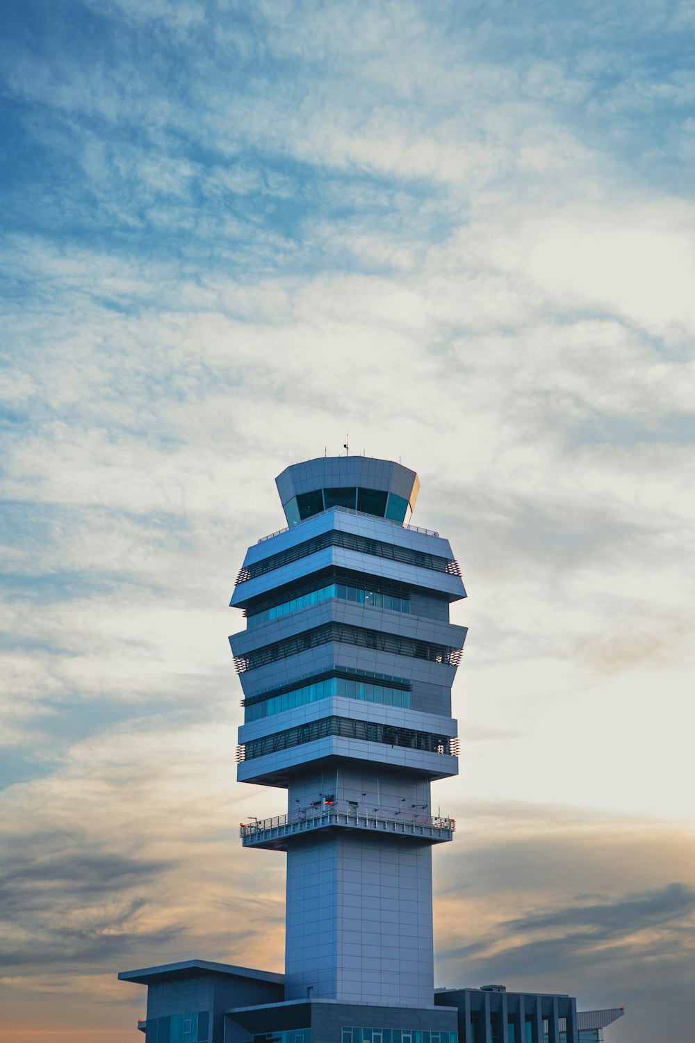 a tall tower sitting on top of a lush green field