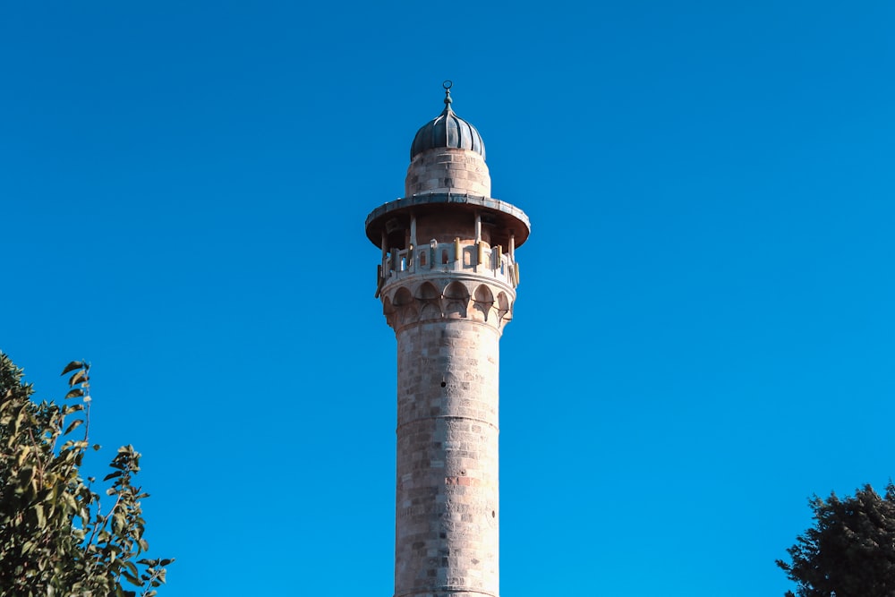 a tall tower with a dome on top of it