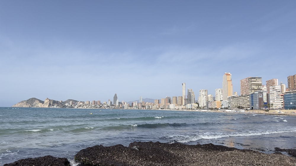 a view of a beach with a city in the background