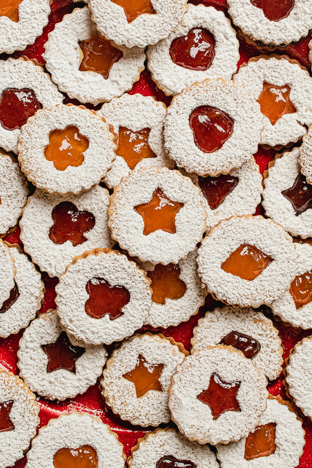 a pile of cookies with jam on them
