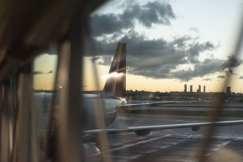 a view of a plane from a window at an airport