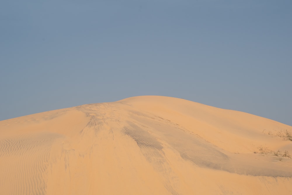 a large sand dune in the middle of a desert