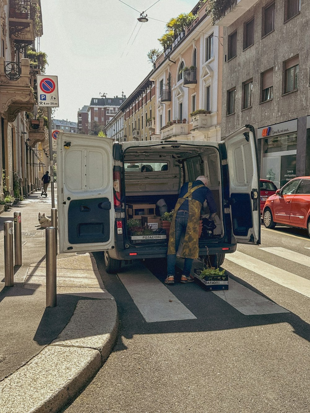 a man loading a van onto the back of a van