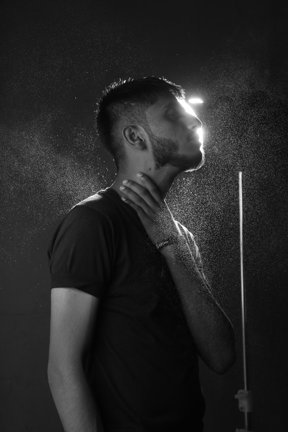 a man standing under a shower of water