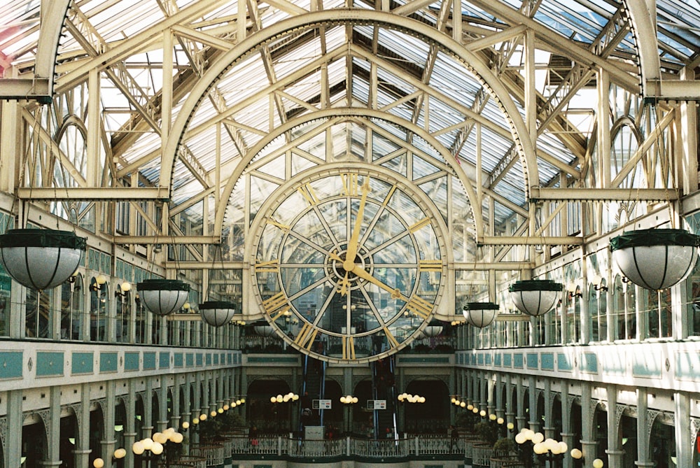 the inside of a building with a clock on the wall