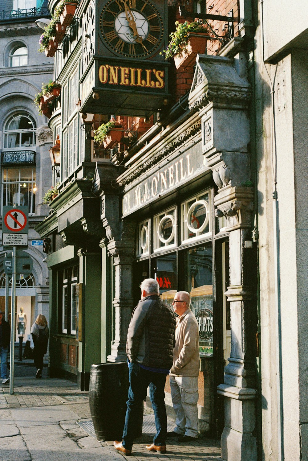 a group of people standing outside of a building