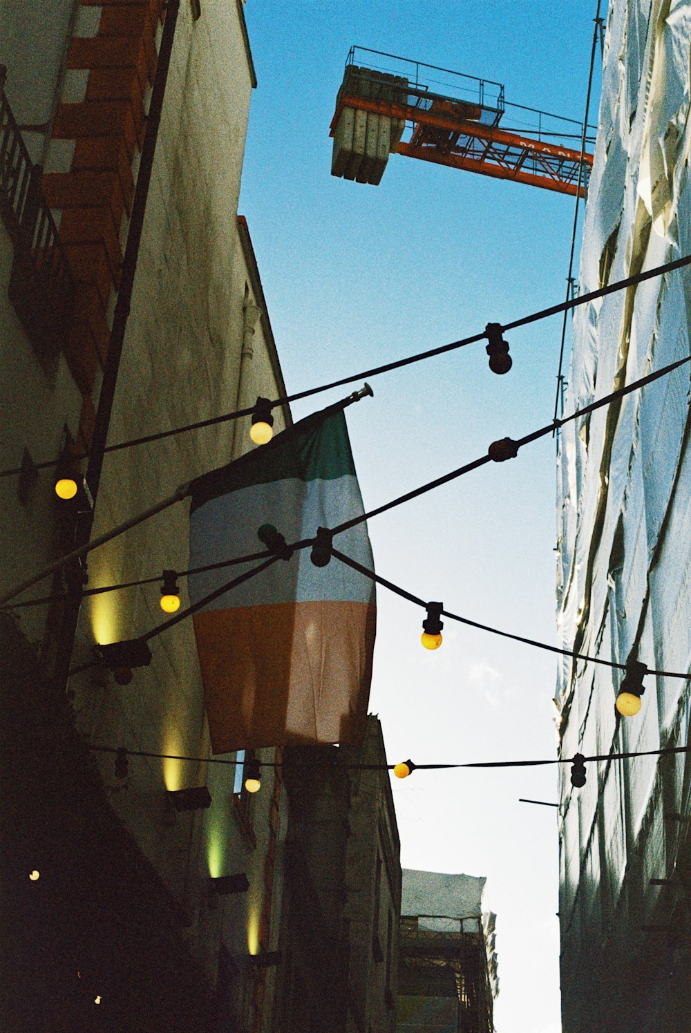 a city street with street lights and a building in the background