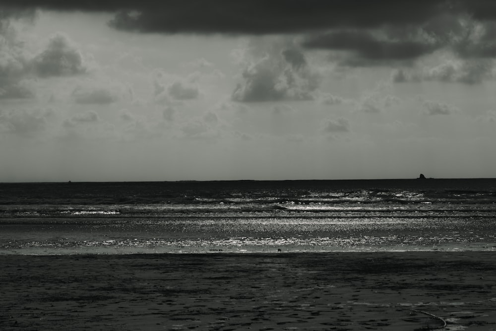 a black and white photo of the ocean