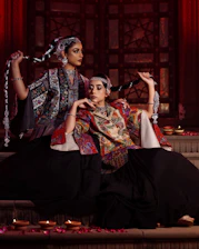 a couple of women sitting next to each other