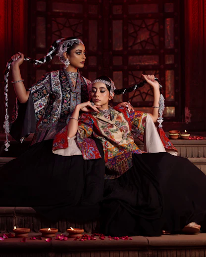 a couple of women sitting next to each other