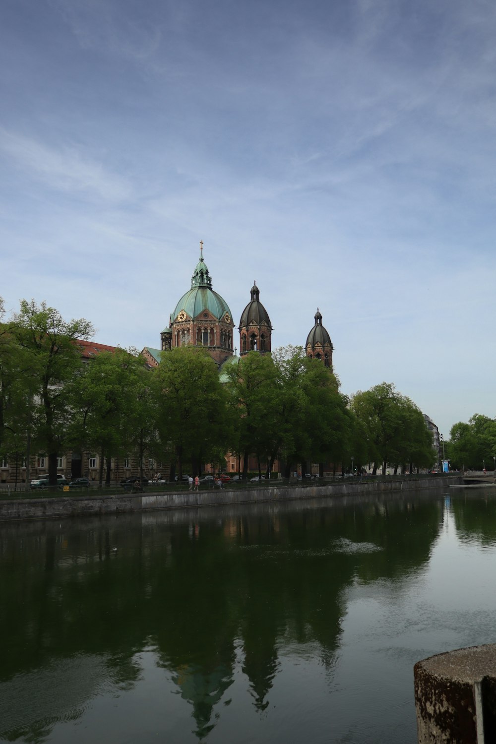 a body of water with a building in the background