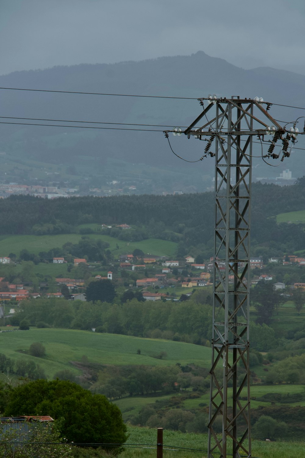 a view of a city from a high voltage power line