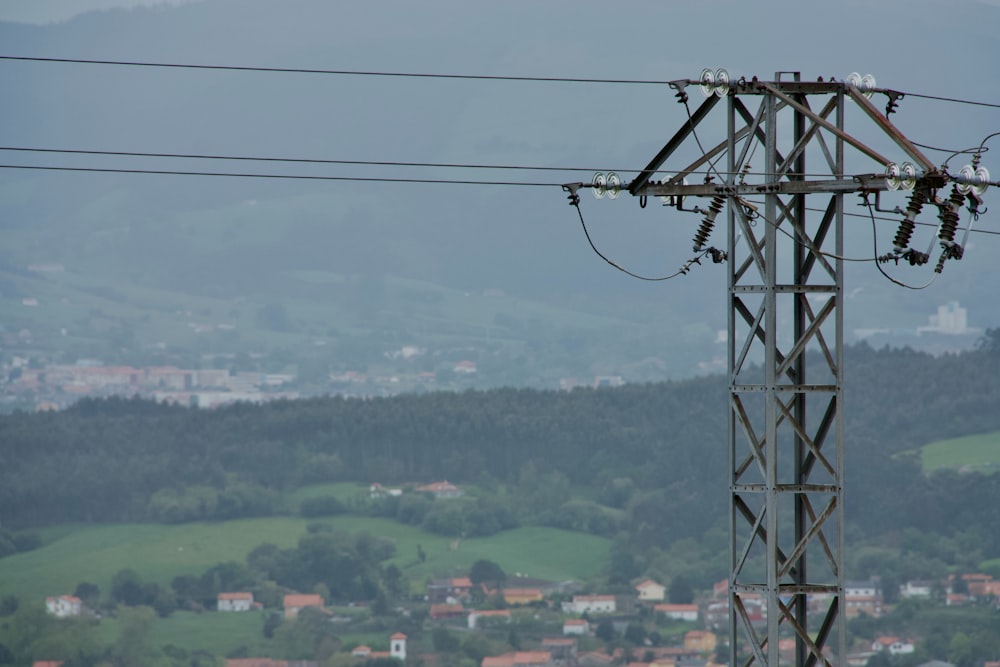 a view of a power line with a city in the background