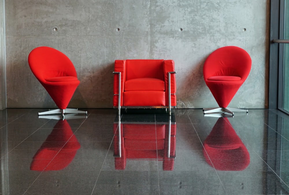 a red chair and a red chair in a room